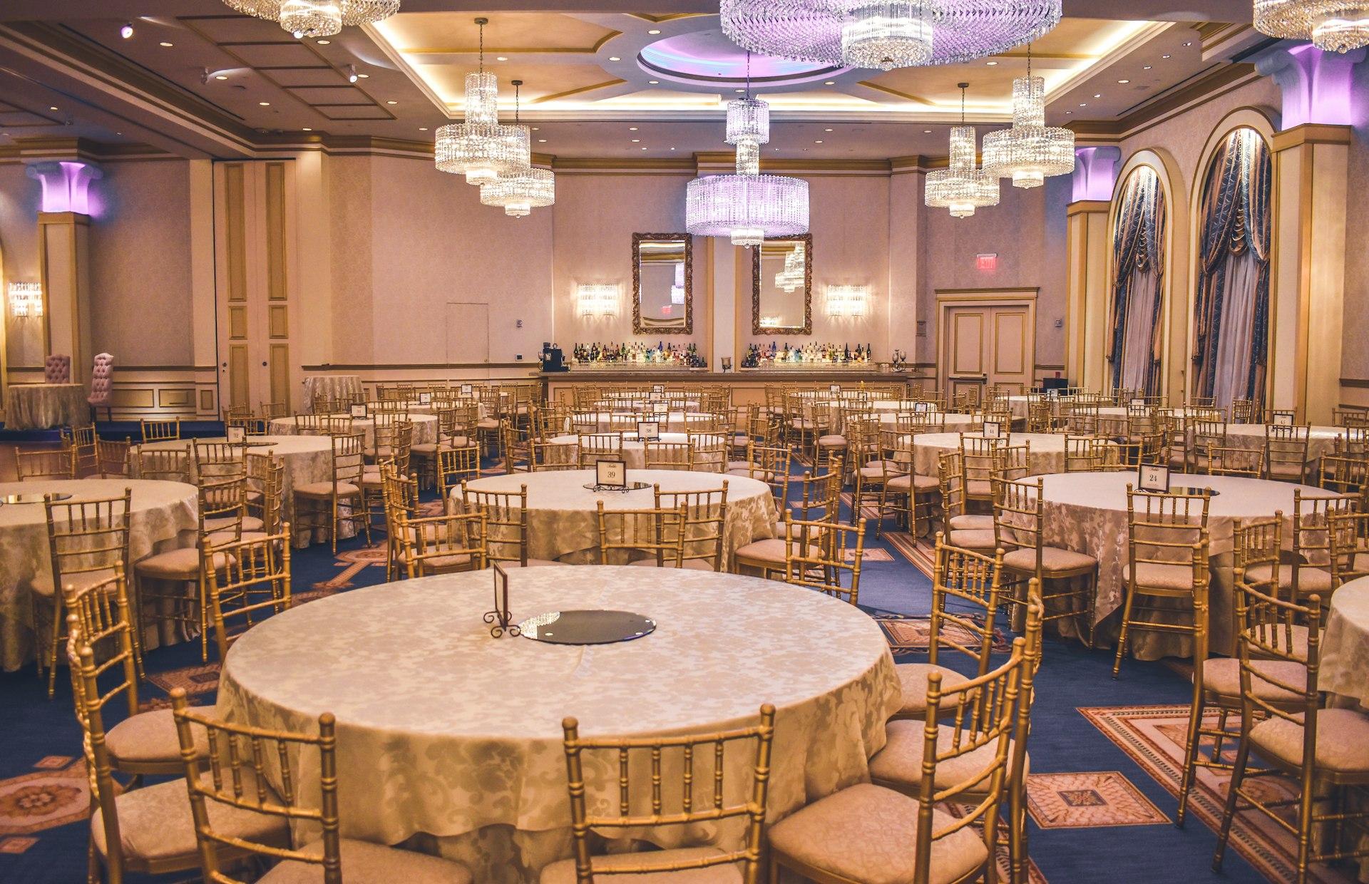 Placeholder: elegantly styled banquet reception with chandeliers